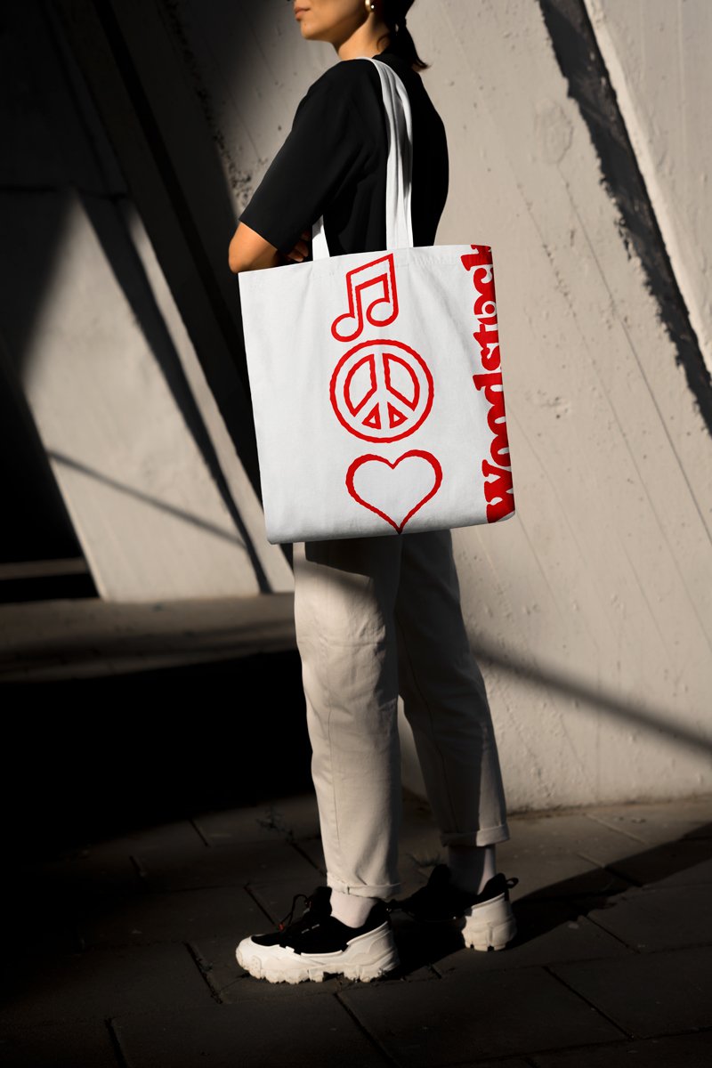Tote bag with peace sign, music note, and heart line art