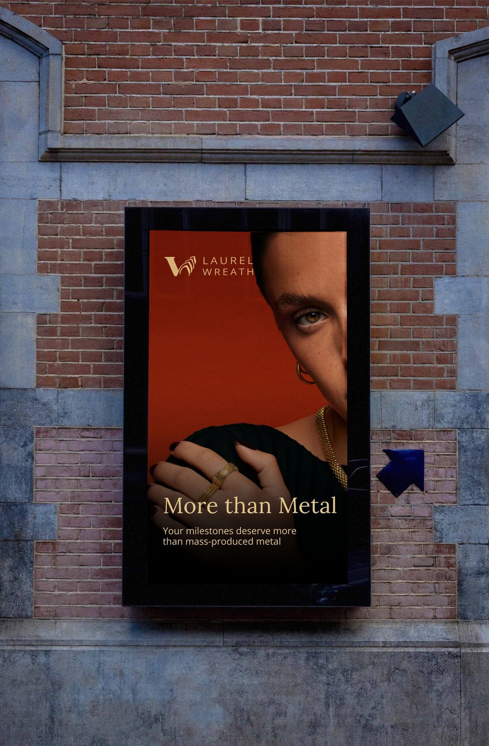 Laurel Wreath digital OOH screen, More Than Metal, on a brick building
