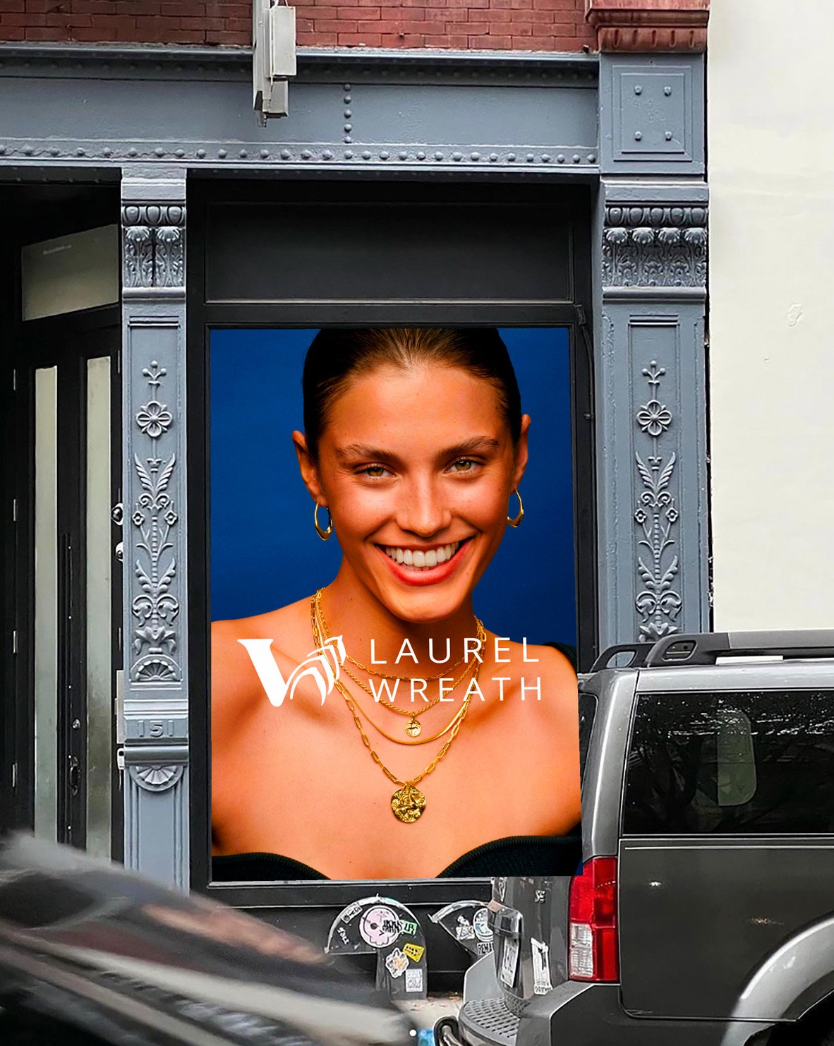 Laurel Wreath poster in a building entrance window, street-level mockup
